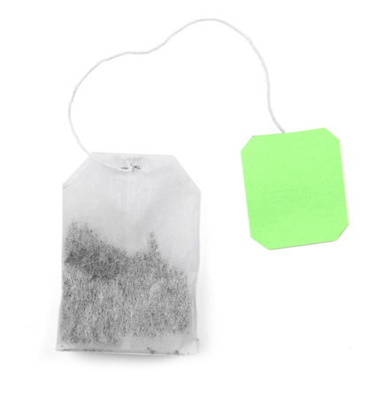 Teabag with green label isolated on white backgroundの写真素材