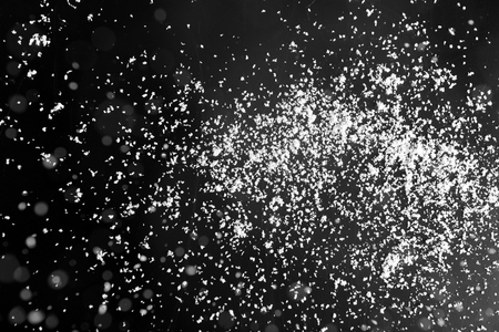 Snow flakes on dark backgroundの写真素材