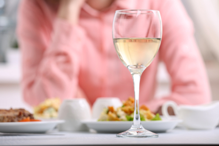Dinner with wine in restaurantの写真素材