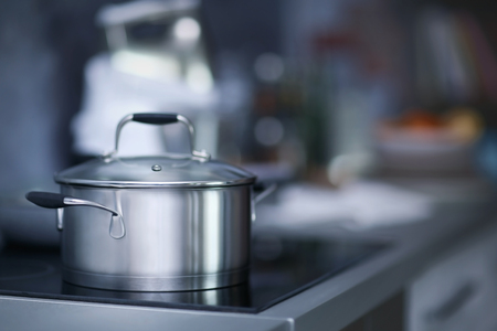 Metal pan on modern electric stove, close upの写真素材
