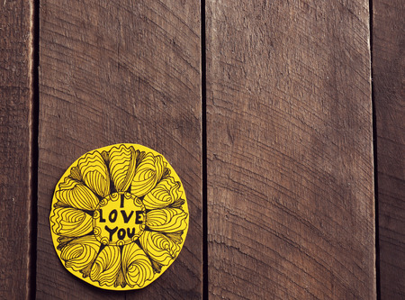 Yellow Valentine with inscription on wooden backgroundの写真素材
