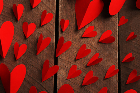 Red paper hearts on wooden background, close upの写真素材