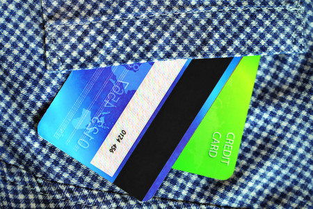 Credit cards in shirt pocket, close up
