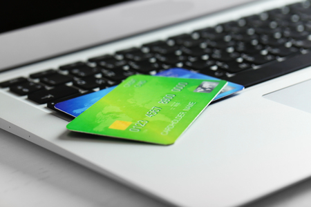 Credit cards on laptop, close upの写真素材
