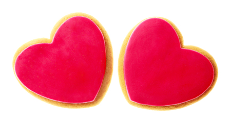 Two Valentine heart cookies isolated on whiteの写真素材