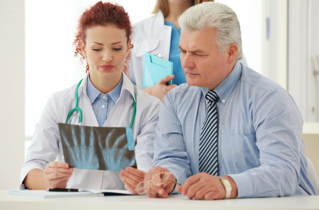 Doctors and patient in office