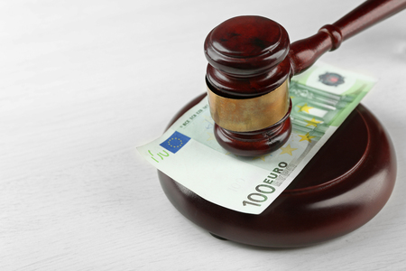 Law gavel with euro isolated on whiteの写真素材