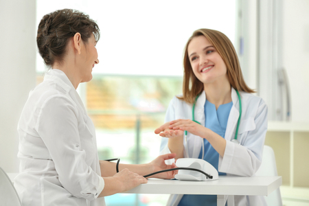 Doctor and patient in officeの写真素材