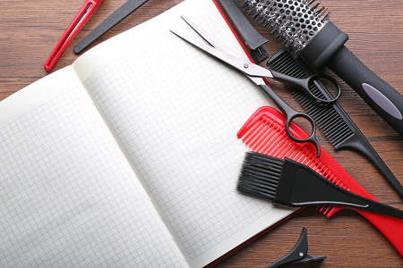 Professional hairdressing equipment on wooden table, copy spaceの写真素材