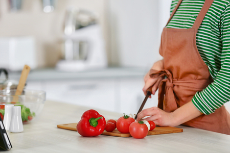 Young woman cooking in the kitchenの写真素材