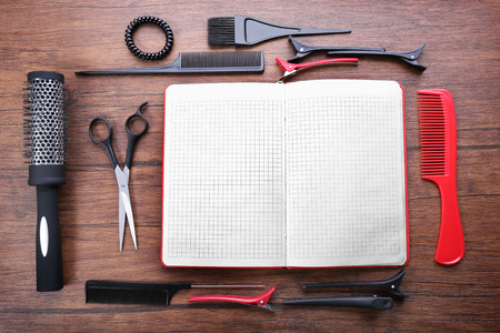 Professional hairdressing equipment on wooden table, copy spaceの写真素材