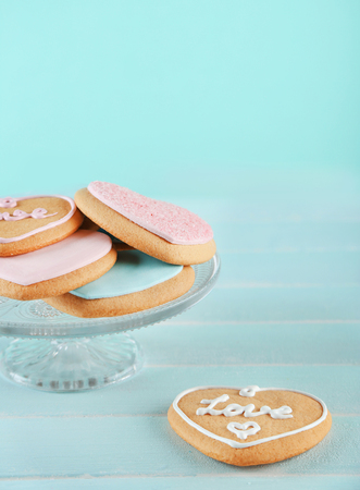 Assortment of love cookies on blue wooden table backgroundの写真素材