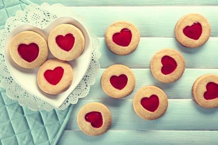 Assortment of love cookies on blue wooden table backgroundの写真素材
