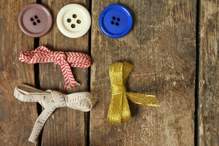 Sewing creative accessories on wooden table, top viewの写真素材
