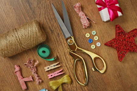 Sewing creative accessories on wooden table, top viewの写真素材