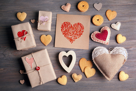 Valentine concept. Card with gift boxes and cookies on wooden table backgroundの写真素材
