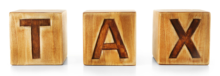 Word TAX written on wooden cubes isolated on whiteの写真素材