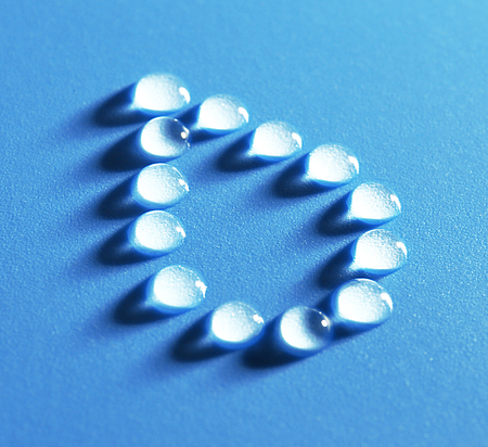 Drop made of water on blue backgroundの写真素材