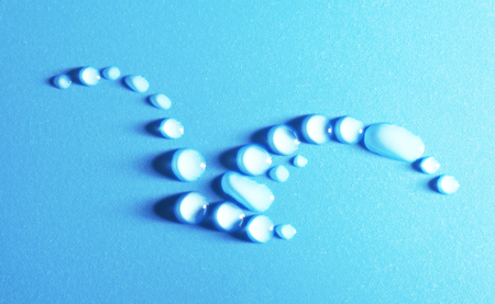 Bird made of water drops on blue backgroundの写真素材