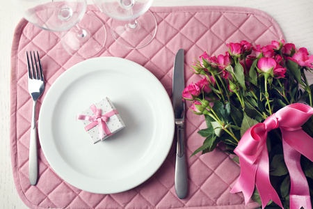 Bouquet of pink roses on a served table, close upの写真素材