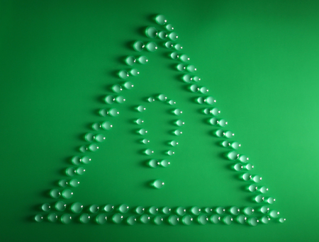 Water drops on a green surface, top viewの写真素材