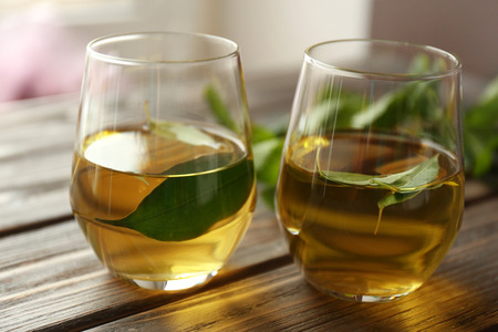 Cups of tea on wooden tableの写真素材