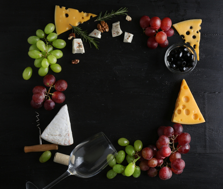 Wine, snacks and different various of cheese, flat layの写真素材