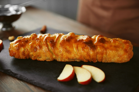 Baked apple roll on a slate plateの写真素材