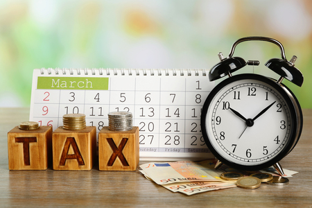 Tax time and alarm clock with euro and calendarの写真素材