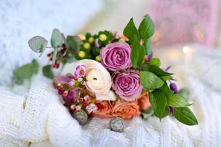 Bouquet of roses on a woolen blanket, closeupの写真素材