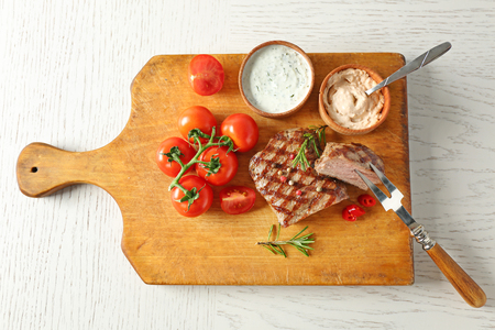 Delicious grilled steak on cutting boardの写真素材