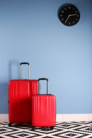 Suitcases on blue wall backgroundの写真素材