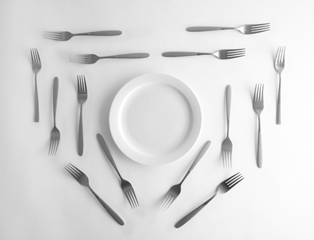 Plate and silver forks, top viewの写真素材