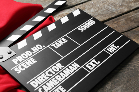 Movie clapper on wooden backgroundの写真素材