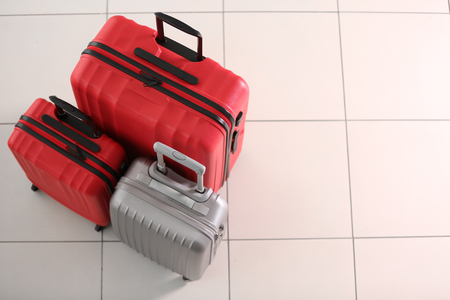 Suitcases on tile backgroundの写真素材