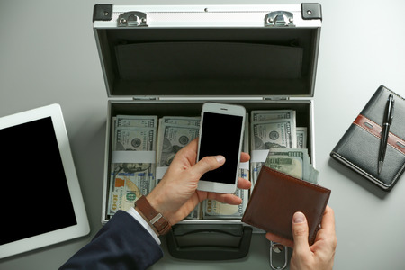 Businessman with wallet, money and accessoriesの写真素材