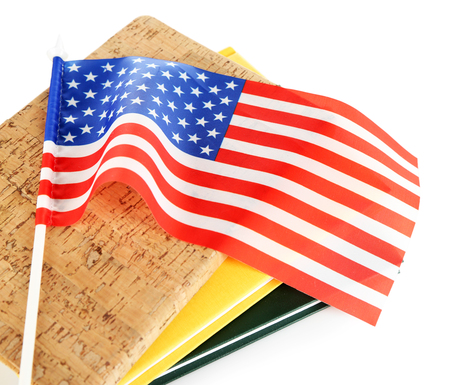 USA flag and books on white backgroundの写真素材