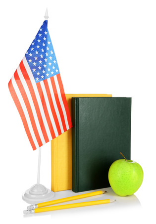 USA flag and books on white backgroundの写真素材