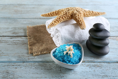 Spa treatment with sea salt on wooden backgroundの写真素材