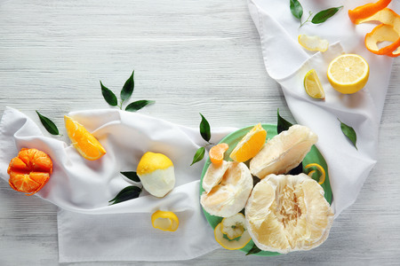 Fresh citrus fruits on a white tableclothの写真素材