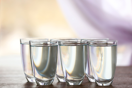 Glass of fresh water on wooden tableの写真素材