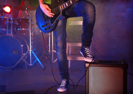 Musician's foot stepped on amplifierの写真素材