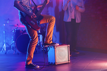 Man playing electric guitar on a stage.の写真素材
