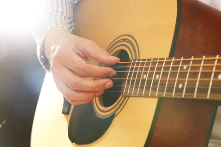 Man playing acoustic guitar