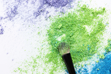 Makeup brush with cosmetic powder isolated on whiteの写真素材