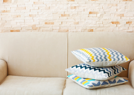 Stylish pillows on grey couchの写真素材
