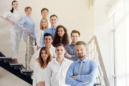 Group of people standing on the stairsの写真素材