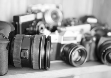 Modern and retro cameras on wooden shelf, closeupの写真素材