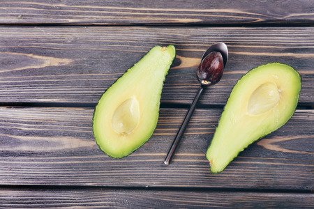 Fresh avocado on wooden background
