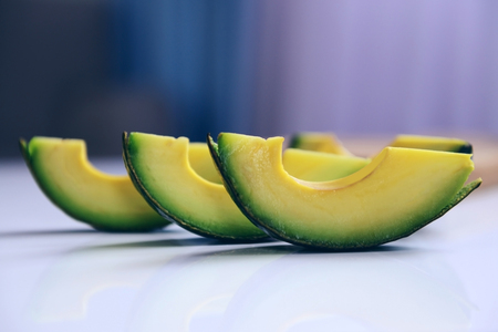 Sliced avocado on a tableの写真素材
